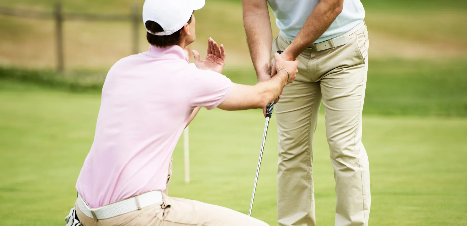 Instructor adjusting a student’s grip