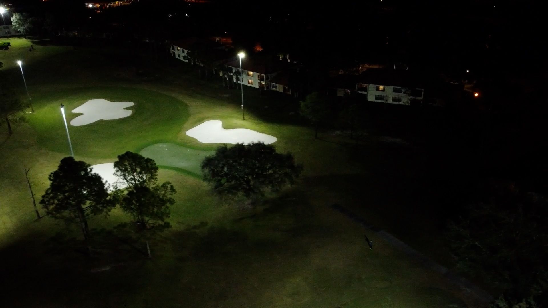 Legends Walk illuminated by stadium lights at night