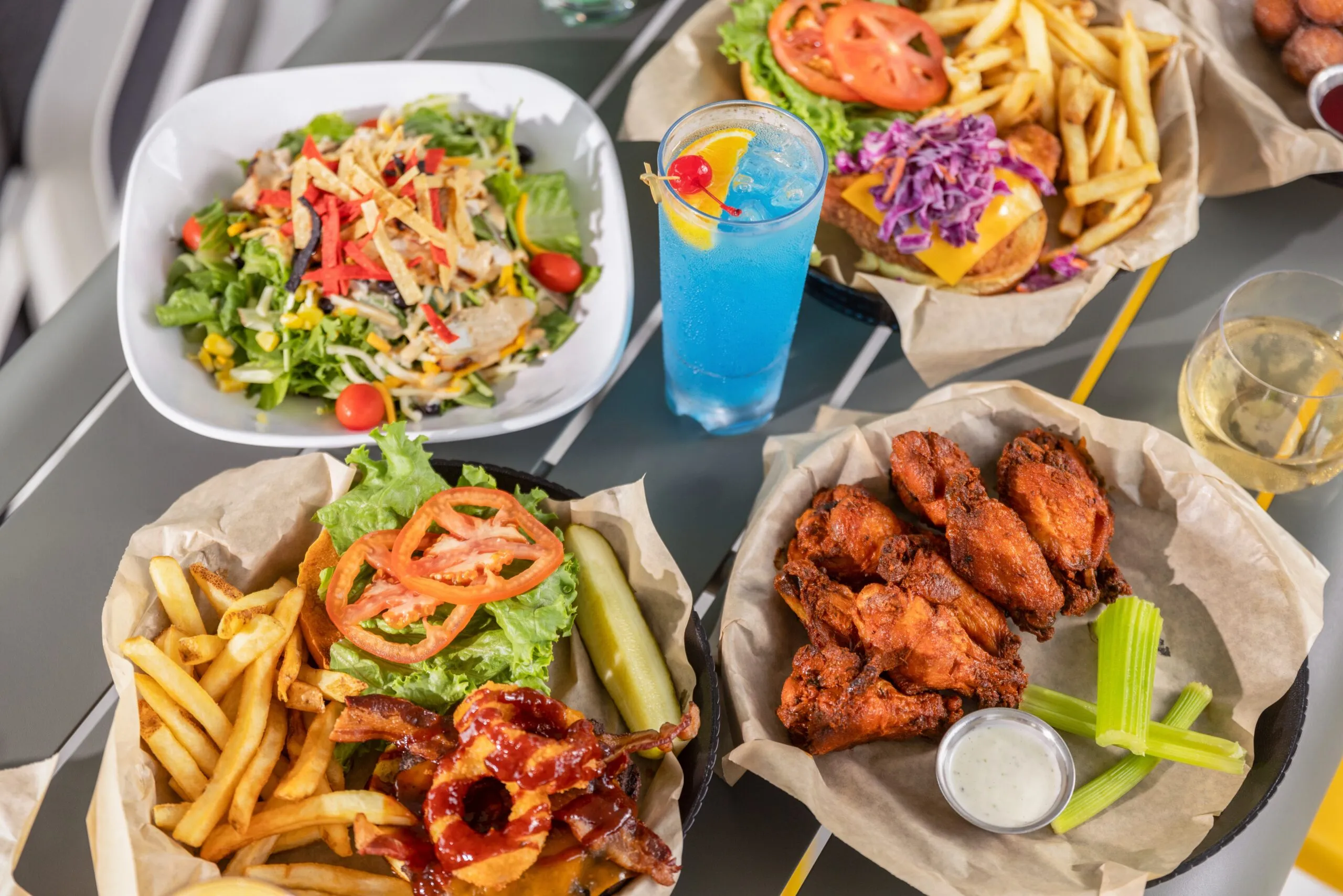 Wings, fries, salad and drinks from the Palmer Lounge